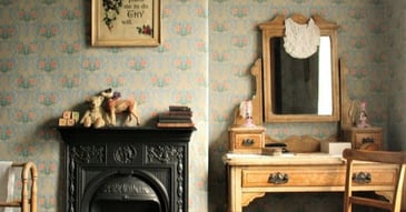 vintage aesthetic bedroom complete with flowered wallpaper and dressing table
