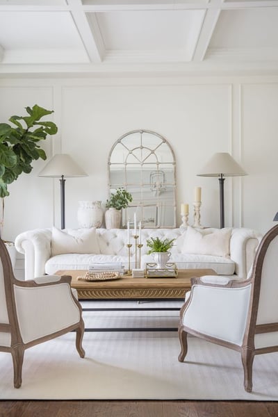 Elegant white lounge area with white sofa