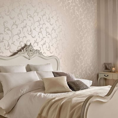 metallic bronze and cream patterned wallpaper with matching bed and headboard 