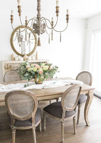 distressed wood dining table and chairs in grey and white rustic french dining room