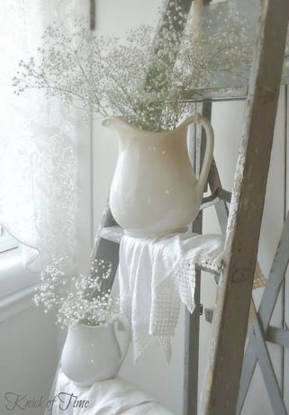white ceramic vintage jug with baby's breath flowers