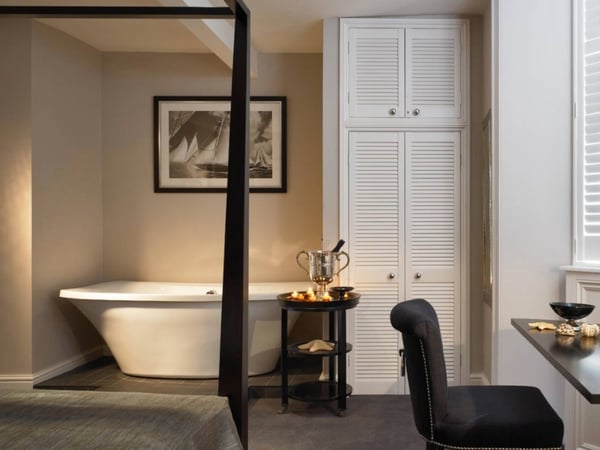 bathtub in bedroom in boutique hotel