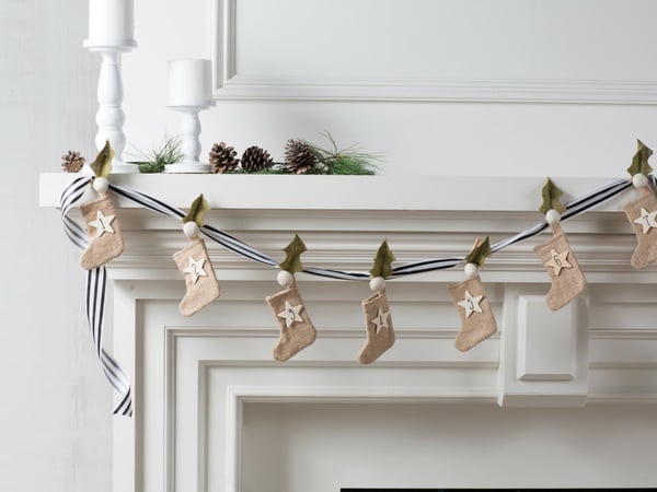 mini stocking garland in beige - christmas bedroom inspiration